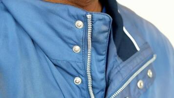 Man zipper on a jacket in cold autumn day. video