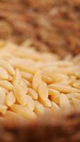 vertical shot of brown long rice on table . video