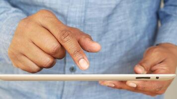 man's hand working on digital tablet on office desk video
