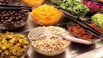 Closeup of fresh salad bar ingredients, colorful and healthy selection for a nutritious meal video