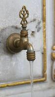 water pouring from a faucet tap outdoor in istanbul video