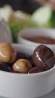 Collection of black and green olives in container video