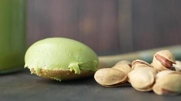 pistachios cream on a spoon and nuts in a bowl video