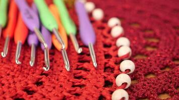 Colorful Crochet Hooks, Red Doily with Beads Supplies for various textile projects video