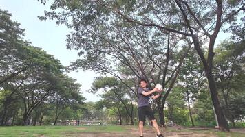 Male and female soccer players practice using the ball in the park field diligently and happily. video