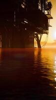 Offshore oil rig platform in sunset or sunrise time video