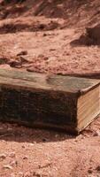 old book in red rock desert video