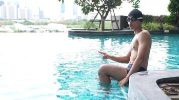 Asian men practicing swimming and preparing to play water polo and stretching and resting for water sports. video