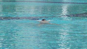 Asian men practicing swimming and preparing to play water polo and stretching and resting for water sports. video