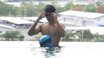 Asian men practicing swimming and preparing to play water polo and stretching and resting for water sports. video