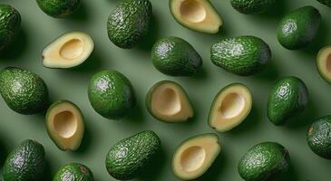 Freshly Sliced Avocados With Basil Leaves on a Green Background photo