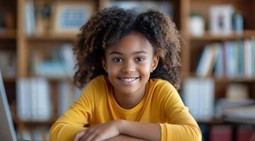 Smiling Young Girl With Curly Hair in Yellow Shirt Indoors photo