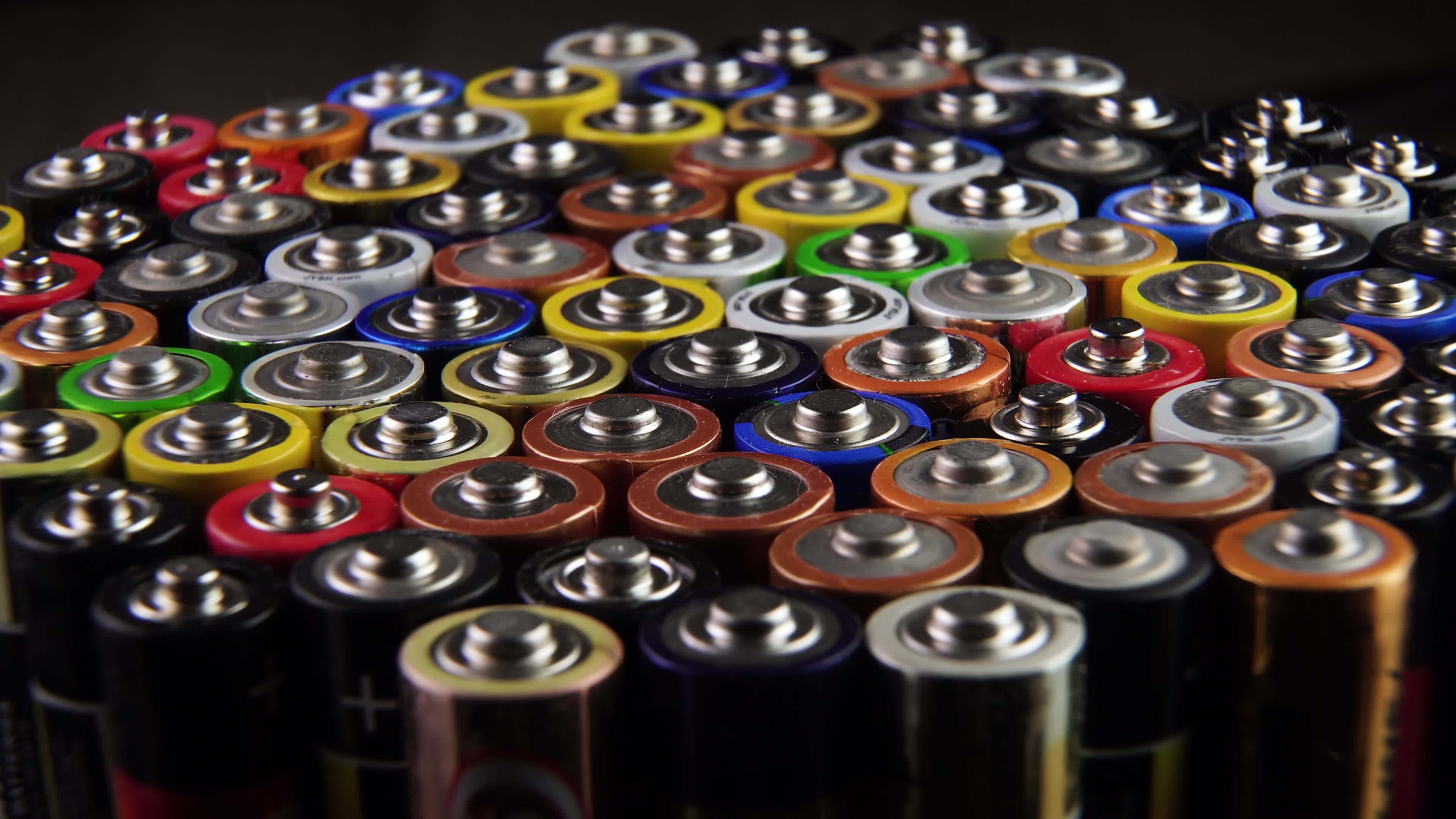 Closeup of used AA batteries. The finger batteries rotate. The harmful