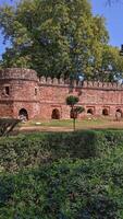 Ancient fortress wall near mausoleum Sikandar Lodi Tomb, Delhi. Intact battlements, arched recesses, bastion. Historical monument, citadel, ramparts. Mughal Empire. Indo-Islamic architecture, Defenses photo