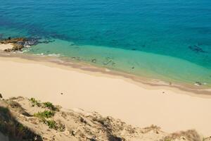 Beholding the Beauty of a Beach with Natural Motif Sands from Above, a Serene Coastal Vista photo