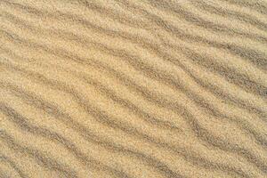 Beholding the Beauty of a Beach with Natural Motif Sands from Above, a Serene Coastal Vista photo