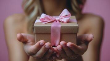 Person Holding a Wrapped Present photo