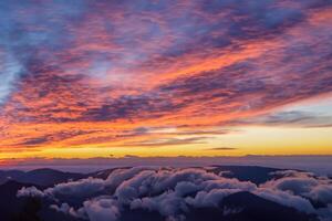 Beautiful Clouds Over the Mountains Create a Harmonious Atmosphere, Painting a Serene and Majestic Scene of Natural Beauty photo