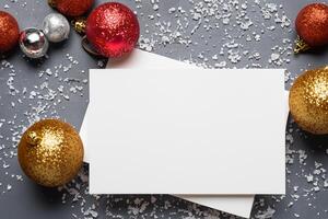 Beautiful Mockup White Card with Christmas Ornaments, A Festive Touch for Your Holiday Greetings photo