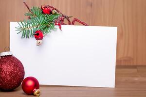 Beautiful Mockup White Card with Christmas Ornaments, A Festive Touch for Your Holiday Greetings photo