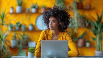 Woman Sitting in Front of a Laptop Computer photo