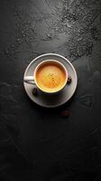 A Cup of Coffee Surrounded by Coffee Beans photo