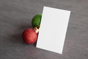 Beautiful Mockup White Card with Christmas Ornaments, A Festive Touch for Your Holiday Greetings photo