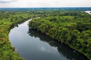 Breathtaking Landscape A Beautiful River Flows Through Charming Air and Lush Trees, Creating a Serene and Picturesque Haven for Nature Lovers to Enjoy and Find Tranquility in the Embrace of Nature photo