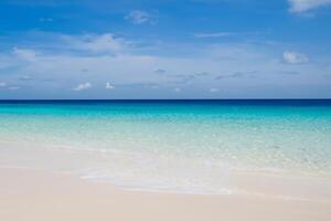 Beautiful Waves and Sands A Mesmerizing Display of Nature's Harmony, Where Crystal Clear Waters Meet Soft Golden Sands, Creating a Serene and Captivating Seascape That Enchants the Soul photo