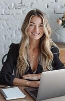 Woman Sitting at Table With Laptop photo