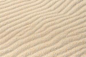 Nature's Elegance Sands as a Beautiful Natural Motif, Where Earth's Artistry Unveils a Tapestry of Delicate Patterns and Warm Hues, Transforming Beaches into Timeless Masterpieces photo