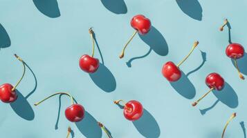 Group of Cherries on Blue Surface photo