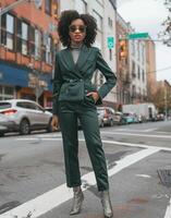 Woman in Green Suit at Street Corner photo