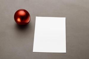 Beautiful Mockup White Card with Christmas Ornaments, A Festive Touch for Your Holiday Greetings photo