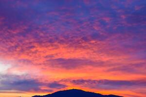 Beautiful Clouds Over the Mountains Create a Harmonious Atmosphere, Painting a Serene and Majestic Scene of Natural Beauty photo