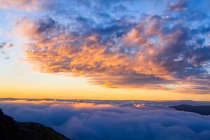 Beautiful Clouds Over the Mountains Create a Harmonious Atmosphere, Painting a Serene and Majestic Scene of Natural Beauty photo