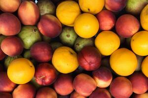 Beautiful Tropical Fruits Background A Luscious Display of Nature's Bounty, Featuring an Abundance of Colorful and Exotic Fruits Against a Vibrant and Refreshing Backdrop photo