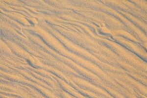 Beholding the Beauty of a Beach with Natural Motif Sands from Above, a Serene Coastal Vista photo