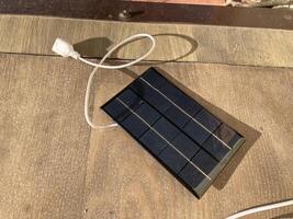 KYIV, UKRAINE - June 1, 2024 Solar panel for charging gadgets photo