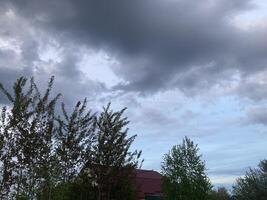 Thunderclouds before rain in the village photo