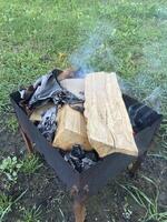 The barbecue grill is lit for cooking outdoors photo