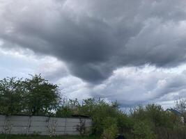 Thunderclouds before rain in the village photo