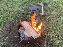 The barbecue grill is lit for cooking outdoors photo