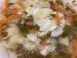 Texture of soup poured into a bowl photo