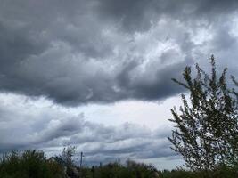 Thunderclouds before rain in the village photo