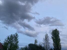 Thunderclouds before rain in the village photo