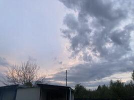 Thunderclouds before rain in the village photo