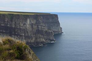 Exploring the Beauty of Majestic Cliffs, Nature's Impressive Coastal Formations photo