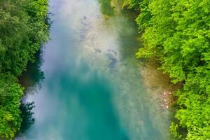 Breathtaking Landscape Experience the Beauty of a Serene River, Charming Air, and Lush Trees in a Picturesque Setting That Captivates the Soul and Refreshes the Spirit photo