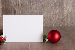 Beautiful Mockup White Card with Christmas Ornaments, A Festive Touch for Your Holiday Greetings photo